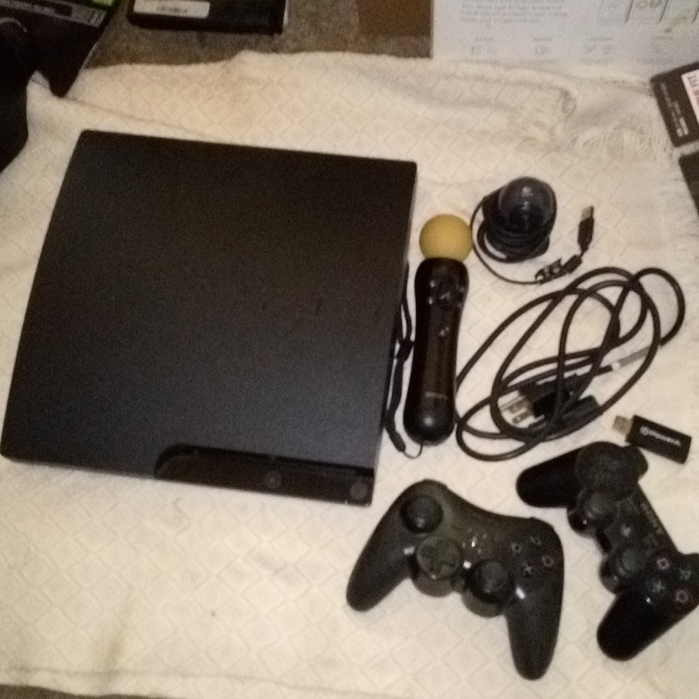 PS3 SLIM 360MB: BARELY USED, 2 controllers, wand, camera, 12 games.
